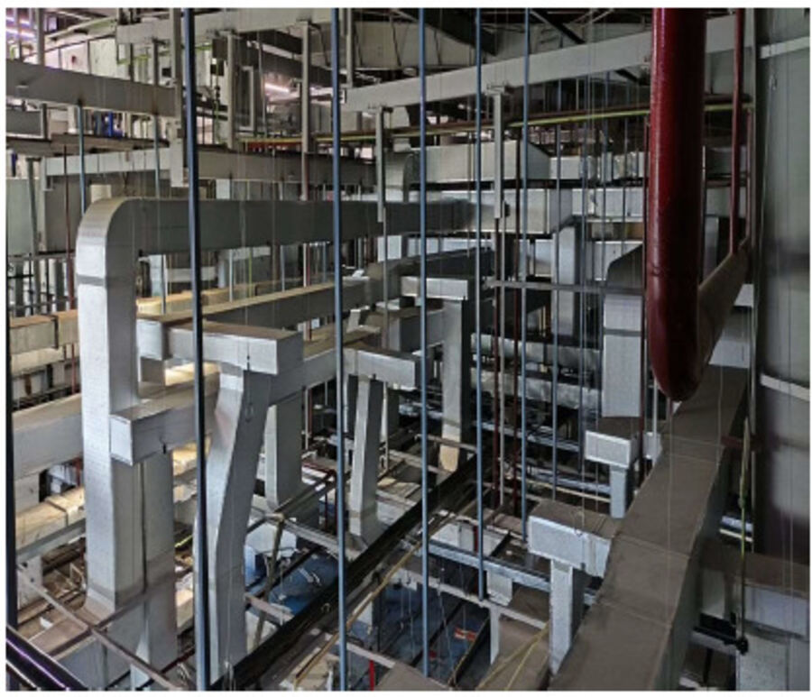 Overhead ducting and piping in a plant service corridor